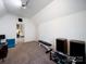 Bright bonus room with vaulted ceilings, natural light and a door leading to another room at 2217 Blue Bell Ln, Charlotte, NC 28270