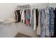 Organized walk-in closet featuring rods and shelving for clothing and accessory storage at 2217 Blue Bell Ln, Charlotte, NC 28270