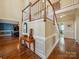 Grand foyer features hardwood floors, elegant staircase with wooden banister, and decorative console table at 2217 Blue Bell Ln, Charlotte, NC 28270