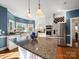 Stylish kitchen features granite countertops, stainless steel appliances, and a central island at 2217 Blue Bell Ln, Charlotte, NC 28270