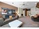 Spacious living room featuring a ceiling fan, built-in shelves, and comfortable seating at 2217 Blue Bell Ln, Charlotte, NC 28270