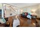 Spacious living room with hardwood floors, staircase, and comfortable seating arrangement at 2217 Blue Bell Ln, Charlotte, NC 28270