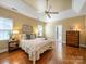 Bright and airy main bedroom with hardwood floors, a king bed, and ample natural light from multiple windows at 2217 Blue Bell Ln, Charlotte, NC 28270