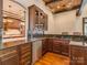 Entertainer's bar area with custom cabinets, granite countertops, and a stainless steel beverage cooler at 235 Blue River Rd, Clover, SC 29710