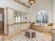 Bathroom featuring a vanity, an arched window with stained glass, and a soaking tub at 235 Blue River Rd, Clover, SC 29710