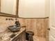 Stylish powder room featuring a vessel sink, granite countertop, and elegant fixtures at 235 Blue River Rd, Clover, SC 29710