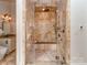 Bathroom featuring a glass door shower with a built in bench and stone surround at 235 Blue River Rd, Clover, SC 29710