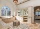 Bathroom featuring a vanity, an arched window with stained glass, and a soaking tub at 235 Blue River Rd, Clover, SC 29710