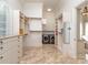 A large walk-in closet with custom built-in shelving, cabinets, and laundry machines at 235 Blue River Rd, Clover, SC 29710