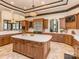 Spacious kitchen featuring custom cabinets, stainless steel appliances, and an island with white marble countertops at 235 Blue River Rd, Clover, SC 29710