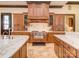 Gourmet kitchen showcases custom cabinetry, premium appliances, and marble backsplash at 235 Blue River Rd, Clover, SC 29710