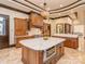 Elegant kitchen with a center island, modern appliances, and a custom lighting fixture at 235 Blue River Rd, Clover, SC 29710