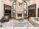 Spacious living room boasts a stone fireplace, built-in shelving, and large windows for natural light at 235 Blue River Rd, Clover, SC 29710