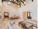 Open living room with vaulted ceilings, elegant lighting, and designer furnishings at 235 Blue River Rd, Clover, SC 29710