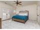 Bright main bedroom with plush carpet, a ceiling fan, and French doors to a patio at 235 Blue River Rd, Clover, SC 29710