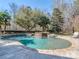 Inviting backyard pool with stone accents, mature trees and a serene, private setting at 235 Blue River Rd, Clover, SC 29710