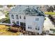 Aerial view of the home featuring a spacious deck, well-manicured yard and light siding at 2689 Wingrave Nw St, Concord, NC 28027