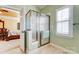 Bathroom showing walk-in shower, tile floor, and view into the main bedroom and walk-in closet at 2689 Wingrave Nw St, Concord, NC 28027