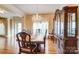 Dining room with hardwood floors, chandelier, and detailed furniture at 2689 Wingrave Nw St, Concord, NC 28027