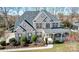 A beautiful brick home seen from above, with a large roof and well-maintained landscaping at 2689 Wingrave Nw St, Concord, NC 28027