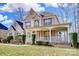 Beautiful brick home with a classic covered front porch and well-maintained yard at 2689 Wingrave Nw St, Concord, NC 28027