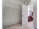 Open door to a walk-in closet with carpeted floors and white wire shelving at 2689 Wingrave Nw St, Concord, NC 28027