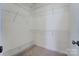 Walk-in closet with carpeted floors and white wire shelving at 2689 Wingrave Nw St, Concord, NC 28027