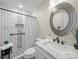 Modern bathroom features a patterned shower, stylish vanity, and sleek fixtures at 2727 Tiergarten Ln, Charlotte, NC 28210