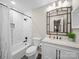 Bright bathroom features a shower over tub with patterned tile and a modern vanity at 2727 Tiergarten Ln, Charlotte, NC 28210