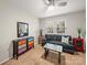 Bright bedroom with colorful dresser, comfortable seating, and great natural light at 2727 Tiergarten Ln, Charlotte, NC 28210