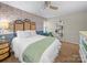 Cozy bedroom with elegant wallpaper, stylish shelving, and neutral decor for a relaxing retreat at 2727 Tiergarten Ln, Charlotte, NC 28210