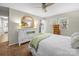 Bright bedroom with white dresser, arched mirror, and neutral decor for a relaxing and stylish space at 2727 Tiergarten Ln, Charlotte, NC 28210