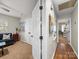 Inviting bedroom featuring art, ample closet space, and a glimpse into the adjacent room at 2727 Tiergarten Ln, Charlotte, NC 28210