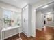 Versatile room with large windows, white cabinetry, and room for small table at 2727 Tiergarten Ln, Charlotte, NC 28210
