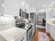 Well-equipped kitchen features stainless steel appliances, granite countertops, and stylish backsplash at 2727 Tiergarten Ln, Charlotte, NC 28210