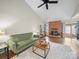 Bright living room featuring vaulted ceilings, brick fireplace, and ample natural light at 2727 Tiergarten Ln, Charlotte, NC 28210