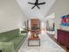 Spacious living room with vaulted ceilings, brick fireplace, and access to dining area at 2727 Tiergarten Ln, Charlotte, NC 28210