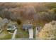 Aerial view of the home featuring mature trees and lush greenery at 2729 Springbrook Cir, Gastonia, NC 28052