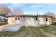 Back of house with a concrete patio and white vinyl siding at 2729 Springbrook Cir, Gastonia, NC 28052