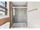 Updated bathroom featuring tile-enclosed shower with glass doors and a rain shower head at 2729 Springbrook Cir, Gastonia, NC 28052