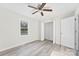 Bright bedroom with a ceiling fan, large window, and a closet, creating a comfortable and functional living space at 2729 Springbrook Cir, Gastonia, NC 28052