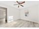 Bright bedroom with a window and light gray wood-look flooring at 2729 Springbrook Cir, Gastonia, NC 28052