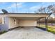 Spacious carport with concrete floor and space for multiple vehicles, attached to home at 2729 Springbrook Cir, Gastonia, NC 28052