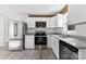 Modern kitchen featuring white cabinets, granite counters, and stainless steel appliances at 2729 Springbrook Cir, Gastonia, NC 28052