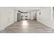 Open concept living area with stylish floors and stainless steel kitchen appliances at 2729 Springbrook Cir, Gastonia, NC 28052