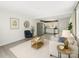 Open-concept living area with modern decor, an area rug, neutral paint, and a stainless steel refrigerator at 2729 Springbrook Cir, Gastonia, NC 28052