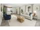 Bright living room featuring modern furniture, neutral tones, and an open layout to the kitchen area at 2729 Springbrook Cir, Gastonia, NC 28052