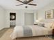 Cozy bedroom with a ceiling fan, a neutral color palette, and an ensuite bathroom with a vanity at 2729 Springbrook Cir, Gastonia, NC 28052