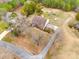 Aerial view of the home highlighting the brick and siding exterior, gravel driveway, and wooded surroundings at 2745 Bonnybrook Cir, Rock Hill, SC 29732