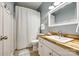 Comfortable bathroom featuring a wood countertop and white tile shower with a white curtain at 2745 Bonnybrook Cir, Rock Hill, SC 29732